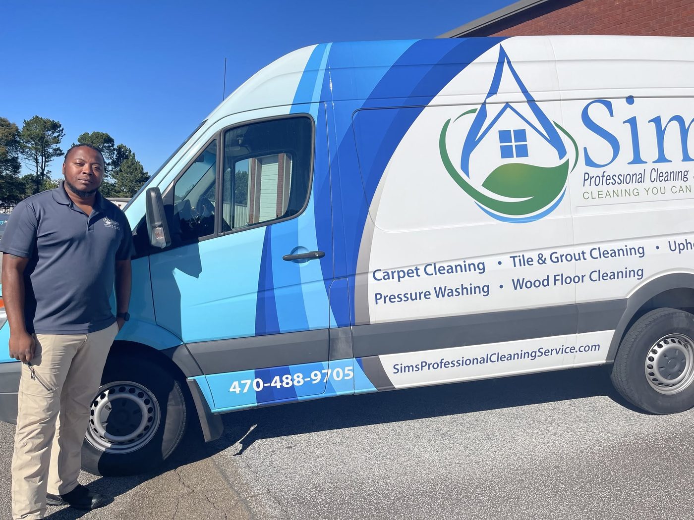 Tyrone Sims with his Sims Professional Cleaning Service van